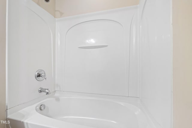 bathroom with shower / tub combination