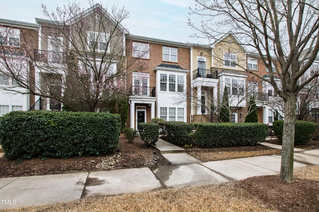 view of property featuring brick siding