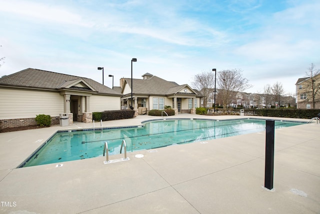 community pool featuring a patio area