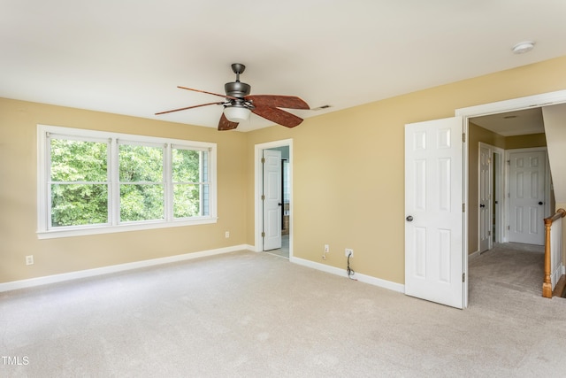 2617 Charenson Pl, Raleigh, NC 27614 - unfurnished bedroom featuring light colored carpet, baseboards, and a ceiling fan