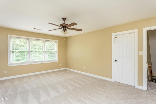 2617 Charenson Pl, Raleigh, NC 27614 - empty room featuring light carpet, ceiling fan, and baseboards