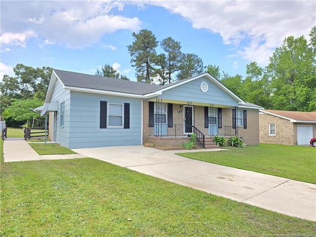 6841 Radial Dr, Fayetteville, NC 28311 - single story home with covered porch, a front lawn, brick siding, and concrete driveway
