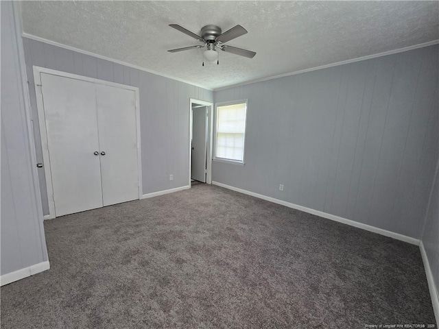 6841 Radial Dr, Fayetteville, NC 28311 - unfurnished bedroom with a textured ceiling, ornamental molding, carpet flooring, baseboards, and ceiling fan