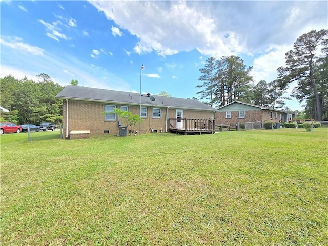 6841 Radial Dr, Fayetteville, NC 28311 - rear view of property with a deck, brick siding, and crawl space