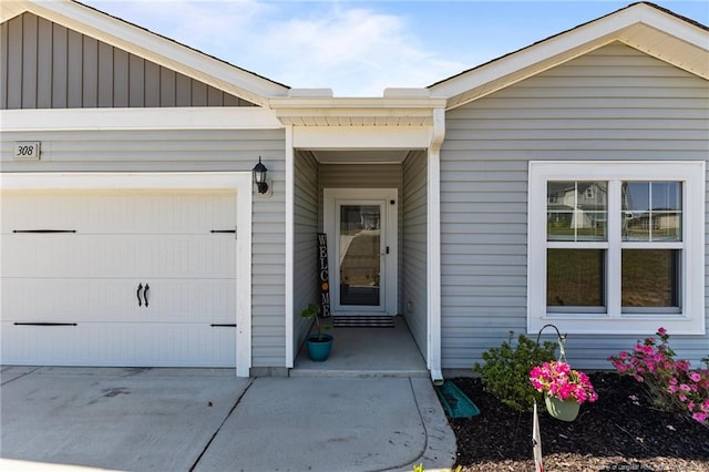 308 Laurel Lake Rd, Salemburg, NC 28385 - property entrance with an attached garage and concrete driveway