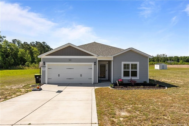 308 Laurel Lake Rd, Salemburg, NC 28385 - single story home featuring driveway, an attached garage, a front yard, and a shingled roof