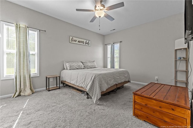 308 Laurel Lake Rd, Salemburg, NC 28385 - carpeted bedroom featuring baseboards and ceiling fan
