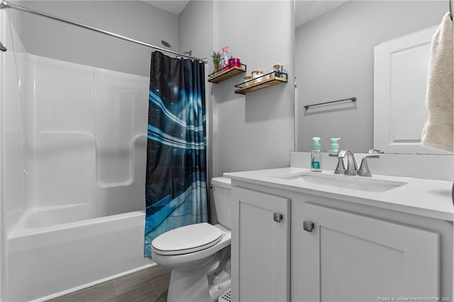 308 Laurel Lake Rd, Salemburg, NC 28385 - bathroom featuring toilet, vanity, shower / tub combo with curtain, and wood finished floors