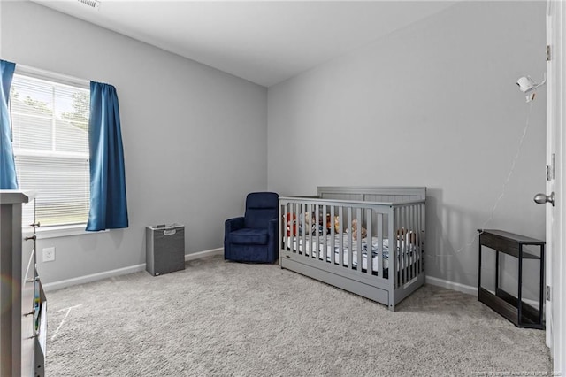 308 Laurel Lake Rd, Salemburg, NC 28385 - carpeted bedroom featuring baseboards and a crib