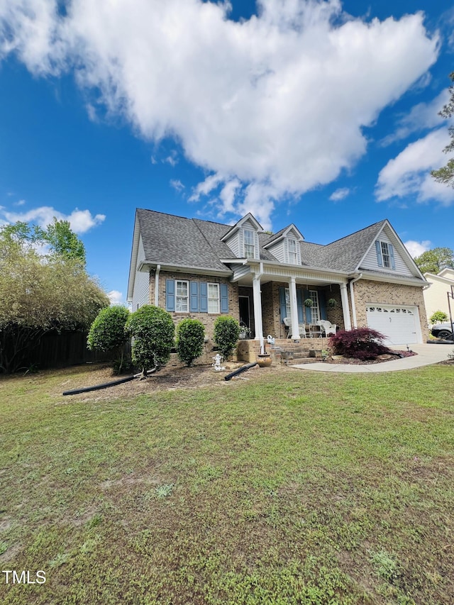 view of front of property featuring a porch, brick siding, and a front lawn