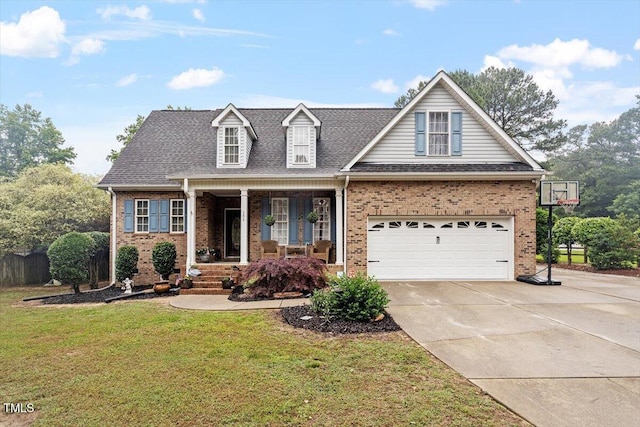 151 Donnibrook Run, Fuquay Varina, NC 27526 - view of front of home featuring covered porch, brick siding, a front lawn, concrete driveway, and roof with shingles