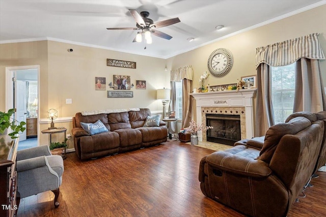151 Donnibrook Run, Fuquay Varina, NC 27526 - living area featuring a ceiling fan, wood finished floors, a tiled fireplace, and ornamental molding