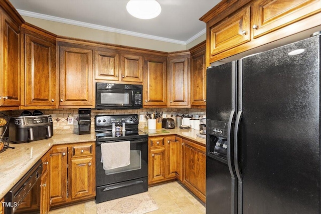 151 Donnibrook Run, Fuquay Varina, NC 27526 - kitchen featuring black appliances, ornamental molding, tasteful backsplash, brown cabinets, and light stone counters