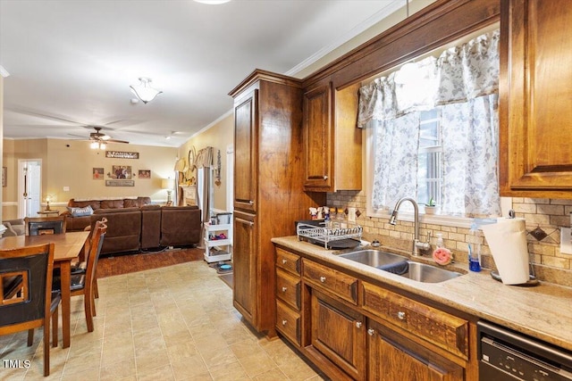 151 Donnibrook Run, Fuquay Varina, NC 27526 - kitchen with dishwasher, a sink, crown molding, ceiling fan, and tasteful backsplash
