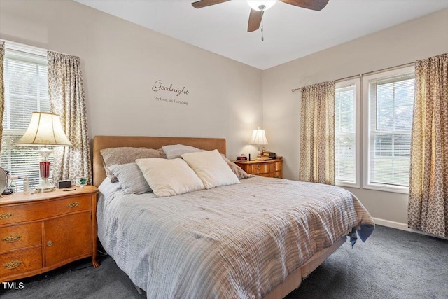 151 Donnibrook Run, Fuquay Varina, NC 27526 - bedroom featuring dark carpet, multiple windows, baseboards, and ceiling fan