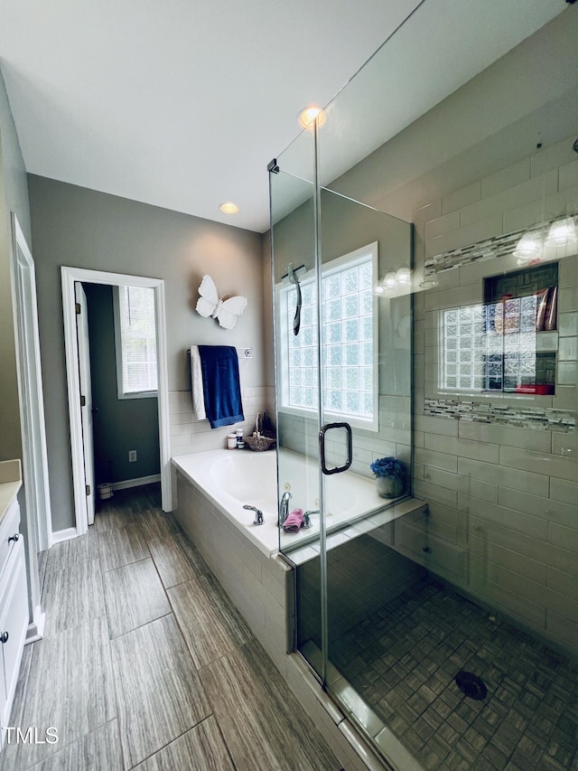 151 Donnibrook Run, Fuquay Varina, NC 27526 - bathroom with vanity, a bath, and a stall shower