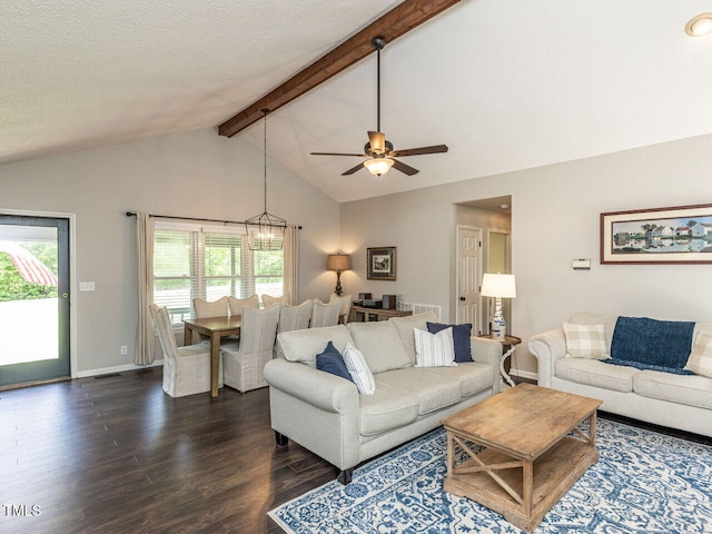 living area with dark wood-type flooring, ceiling fan, baseboards, and a textured ceiling