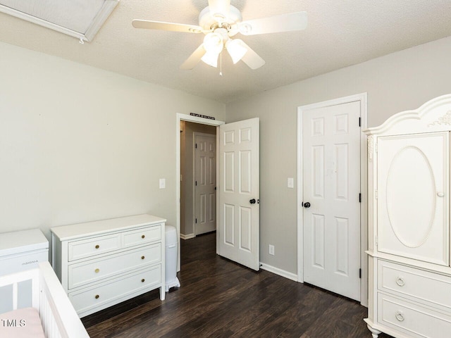bedroom featuring dark wood-style flooring and a ceiling fan