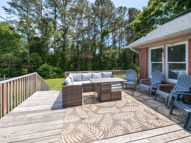 wooden terrace with outdoor lounge area