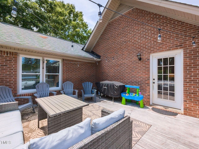 view of patio with an outdoor living space, area for grilling, and a deck