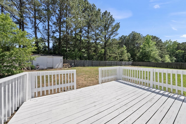 109 Winding Creek Dr, Youngsville, NC 27596 - wooden deck with a storage shed, an outdoor structure, and view of wooded area