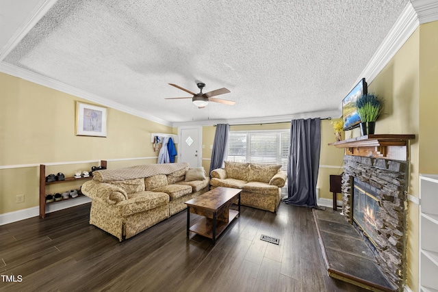 109 Winding Creek Dr, Youngsville, NC 27596 - living room with a ceiling fan, wood finished floors, a stone fireplace, ornamental molding, and a textured ceiling