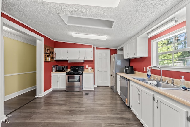 109 Winding Creek Dr, Youngsville, NC 27596 - kitchen featuring appliances with stainless steel finishes, a sink, a textured ceiling, white cabinetry, and under cabinet range hood