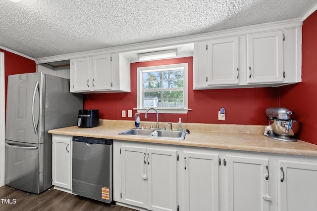 109 Winding Creek Dr, Youngsville, NC 27596 - kitchen featuring appliances with stainless steel finishes, a sink, a textured ceiling, white cabinetry, and light countertops