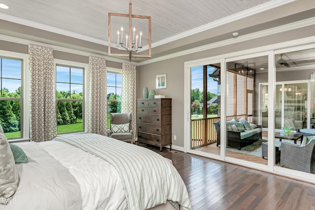 bedroom with access to exterior, hardwood / wood-style floors, a chandelier, multiple windows, and crown molding