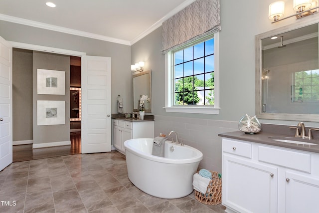 full bath with ornamental molding, a freestanding bath, two vanities, and a shower