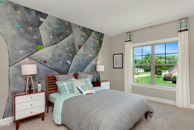 bedroom featuring carpet floors and baseboards