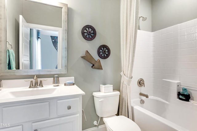 full bathroom featuring toilet, vanity, and shower / bathtub combination with curtain