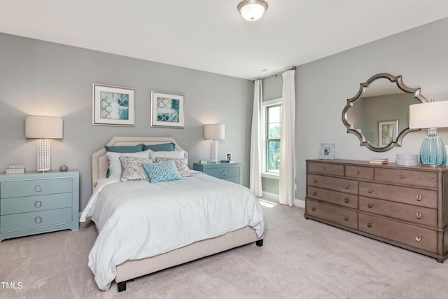 bedroom with carpet floors and baseboards