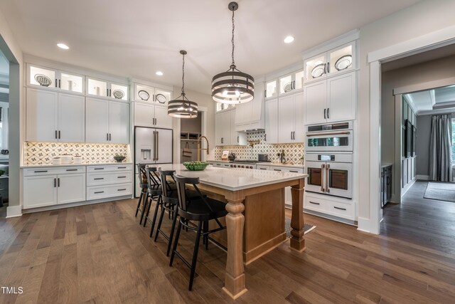 318 Ivy Ridge Rd, Chapel Hill, NC 27516 - kitchen featuring built in refrigerator, light countertops, decorative backsplash, white double oven, and recessed lighting