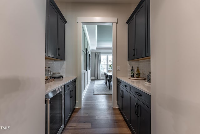 318 Ivy Ridge Rd, Chapel Hill, NC 27516 - indoor dry bar with wine cooler, decorative backsplash, dark wood-type flooring, and baseboards