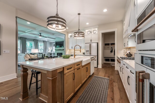 318 Ivy Ridge Rd, Chapel Hill, NC 27516 - kitchen with recessed lighting, coffered ceiling, a sink, white appliances, and ceiling fan