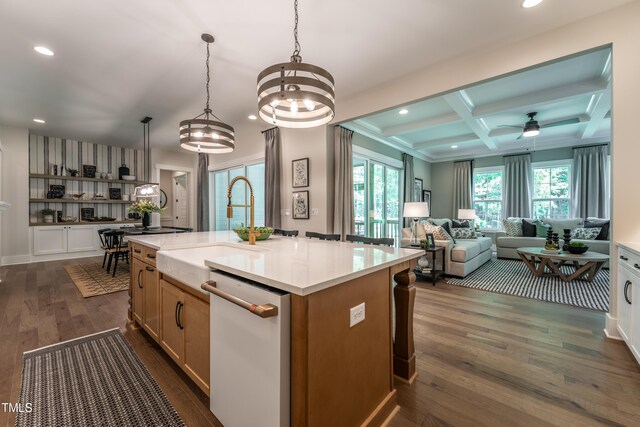 318 Ivy Ridge Rd, Chapel Hill, NC 27516 - kitchen featuring white dishwasher, a sink, beam ceiling, light countertops, and a center island with sink