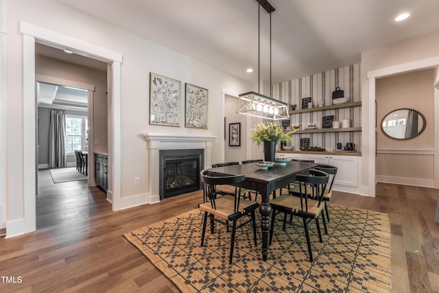 318 Ivy Ridge Rd, Chapel Hill, NC 27516 - dining room with a glass covered fireplace, dark wood-type flooring, baseboards, and recessed lighting