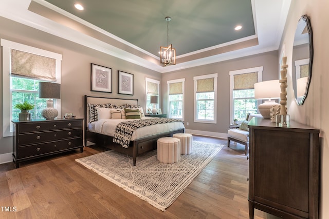 318 Ivy Ridge Rd, Chapel Hill, NC 27516 - bedroom with a raised ceiling, crown molding, a chandelier, wood finished floors, and recessed lighting