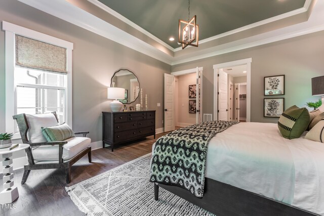 318 Ivy Ridge Rd, Chapel Hill, NC 27516 - bedroom with a chandelier, ornamental molding, a raised ceiling, recessed lighting, and wood finished floors