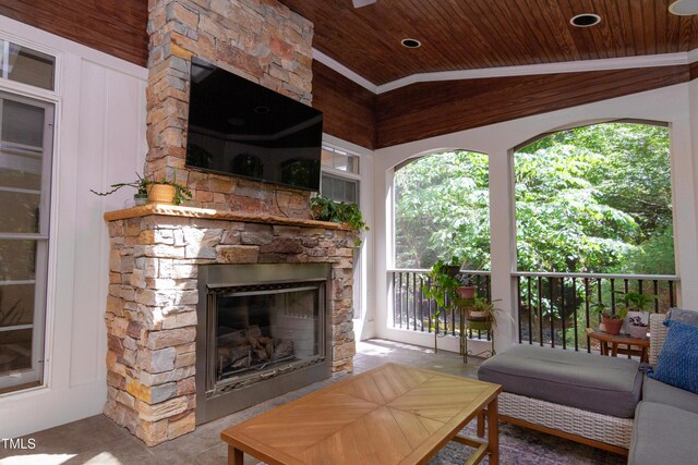 view of patio featuring a stone fireplace