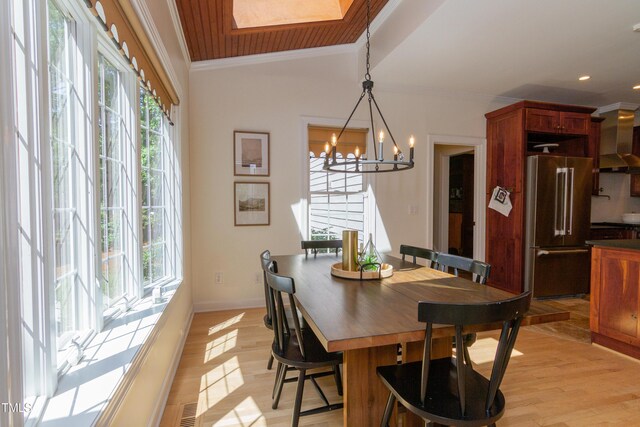 dining area with ornamental molding, a chandelier, light wood finished floors, and recessed lighting
