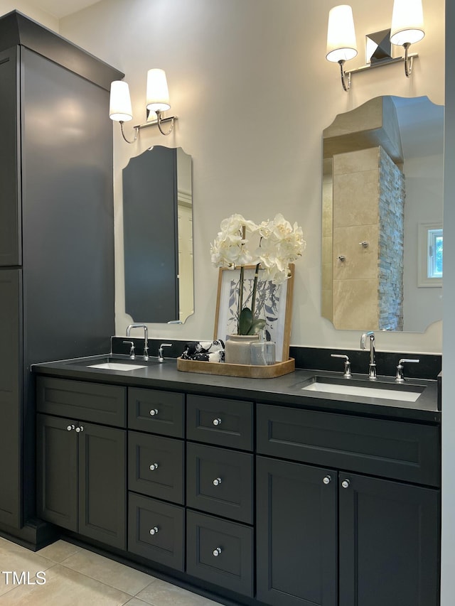 full bathroom featuring tile patterned flooring and double vanity