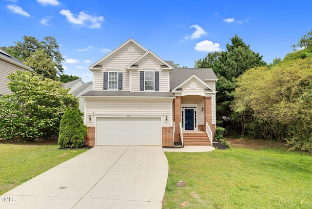8820 Waynick Dr, Raleigh, NC 27617 - view of front of home featuring brick siding, driveway, a garage, and a front yard