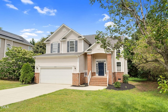 8820 Waynick Dr, Raleigh, NC 27617 - view of front of property featuring brick siding, concrete driveway, an attached garage, and a front yard