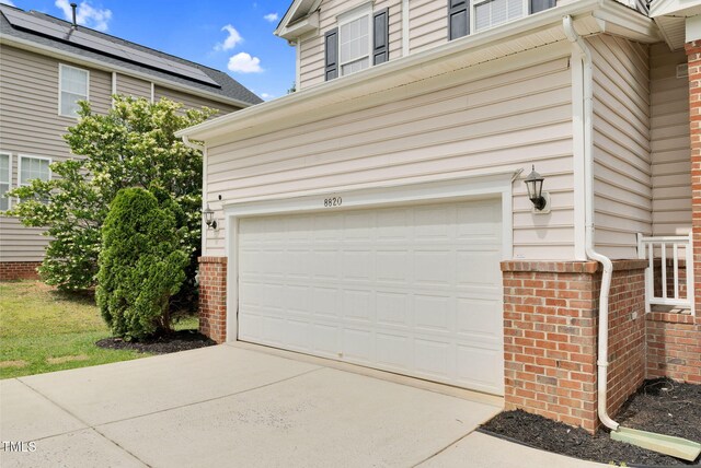 8820 Waynick Dr, Raleigh, NC 27617 - garage featuring concrete driveway