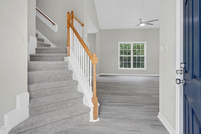 8820 Waynick Dr, Raleigh, NC 27617 - foyer entrance featuring ceiling fan, stairs, baseboards, and wood finished floors