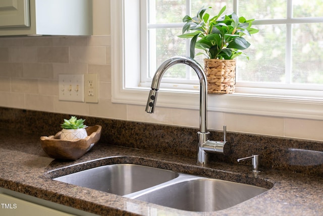 8820 Waynick Dr, Raleigh, NC 27617 - kitchen view of a sink, backsplash, and dark stone counters