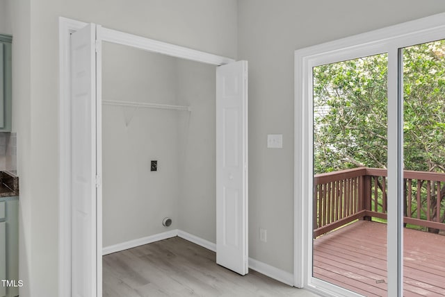 8820 Waynick Dr, Raleigh, NC 27617 - laundry area featuring hookup for an electric dryer, light wood-type flooring, and baseboards
