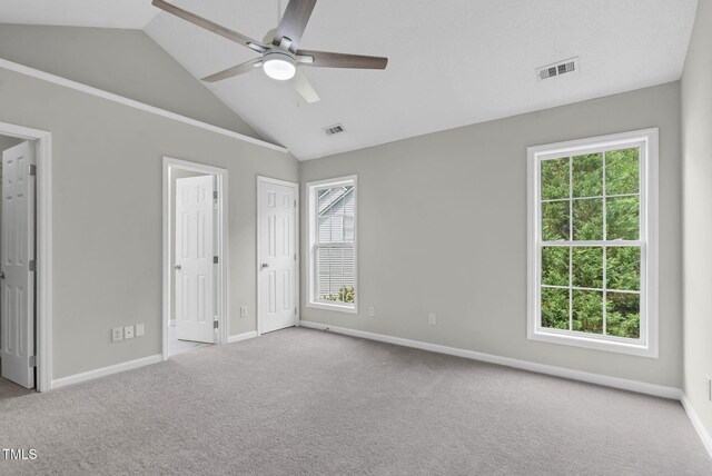 8820 Waynick Dr, Raleigh, NC 27617 - unfurnished bedroom featuring carpet floors, baseboards, high vaulted ceiling, and a ceiling fan